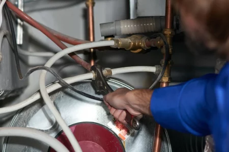 cropped-shot-of-a-handyman-repairing-a-pipe-on-a-w-2025-04-06-09-38-22-utc